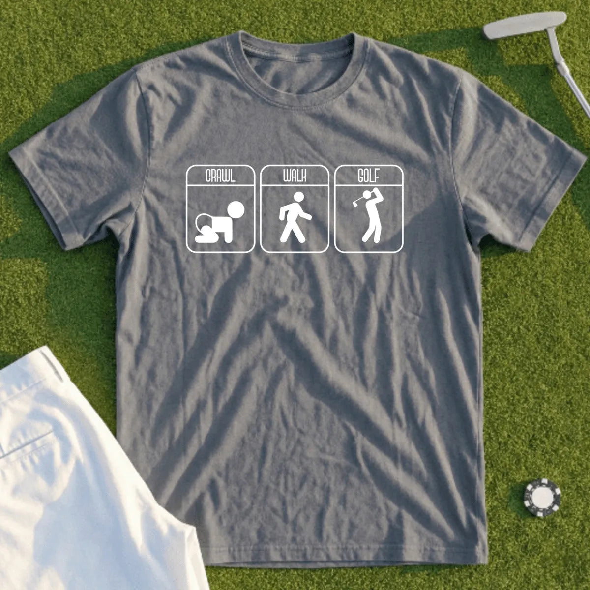Grey t-shirt with icons of crawling, walking, and golf swings with text.