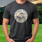 Cypress Point Passport Stamp Tee worn on the golf course, Black