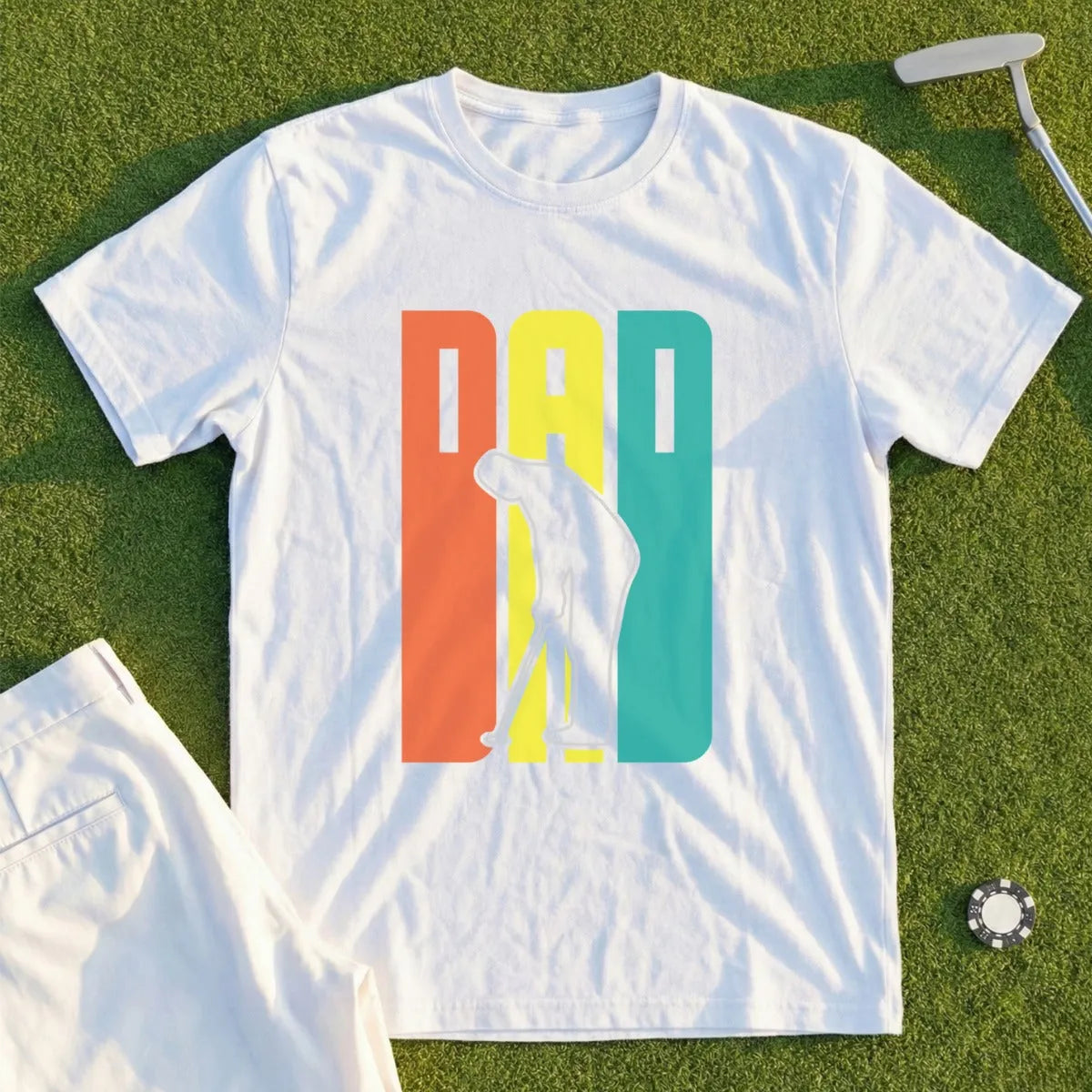 White t-shirt with "DAD" in colorful blocks and a golfer graphic.