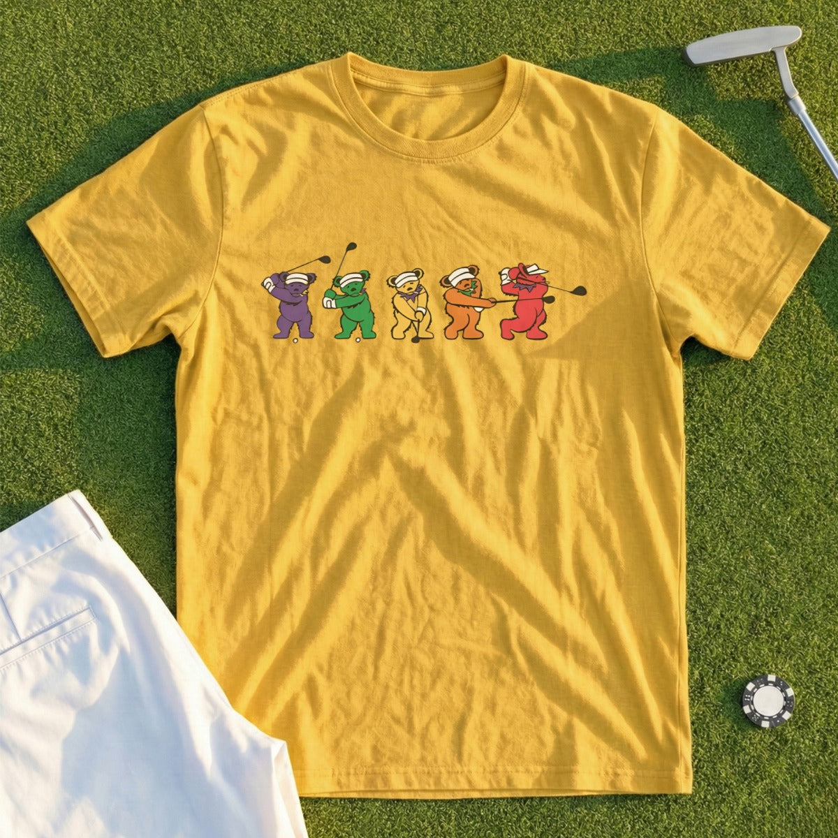 Yellow t-shirt with dancing bear golf characters and a golf club.