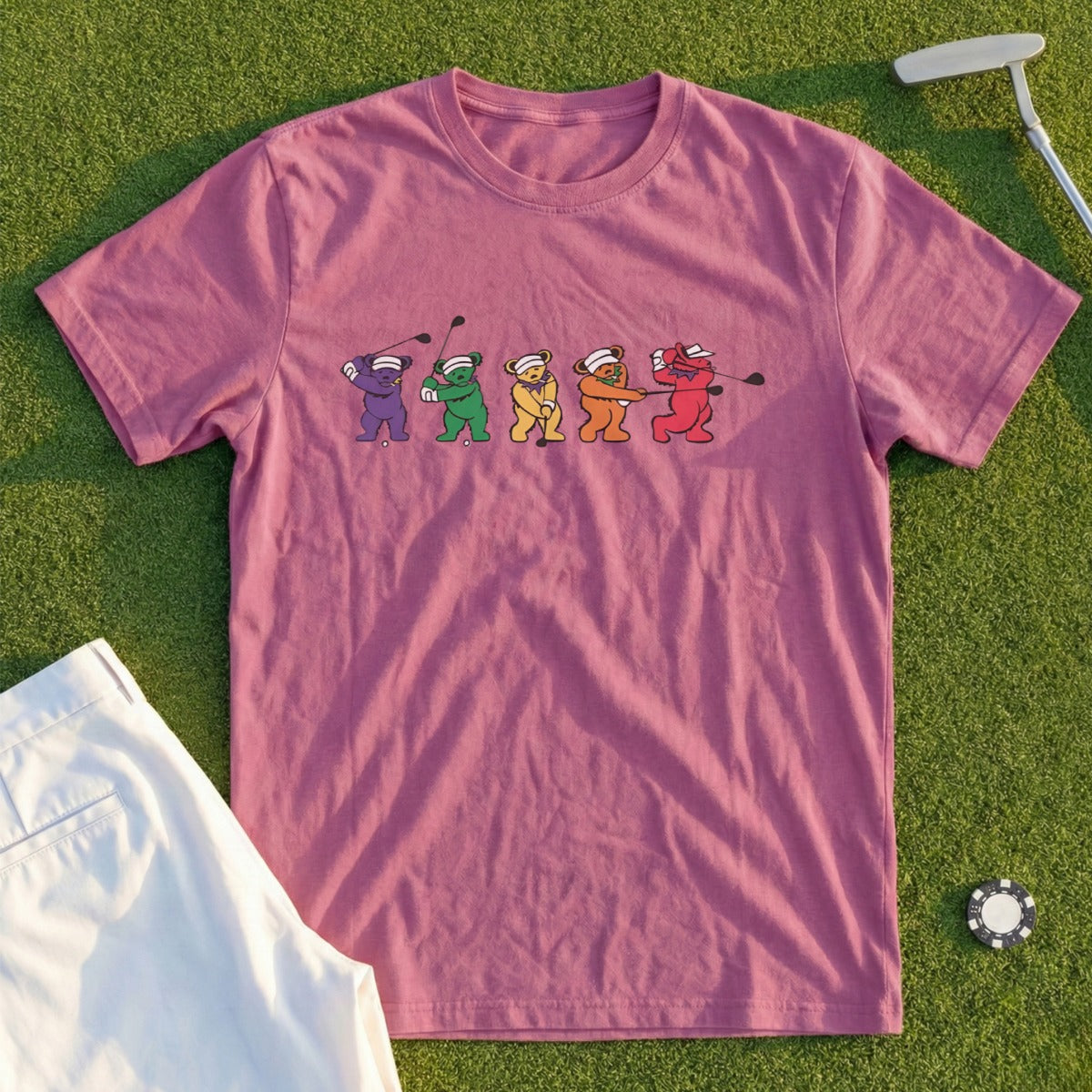 Five cartoon bears in golf attire swing clubs on a purple t-shirt.