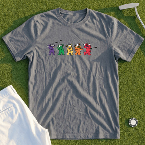 Gray t-shirt with cartoon bears playing golf, white shorts, and a golf ball.