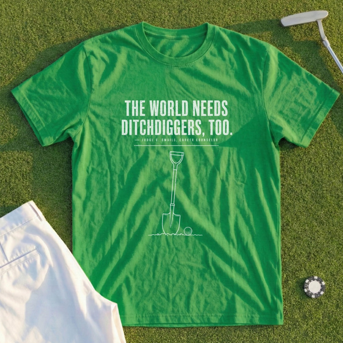 Green t-shirt with "The world needs ditchdiggers, too" and shovel graphic.