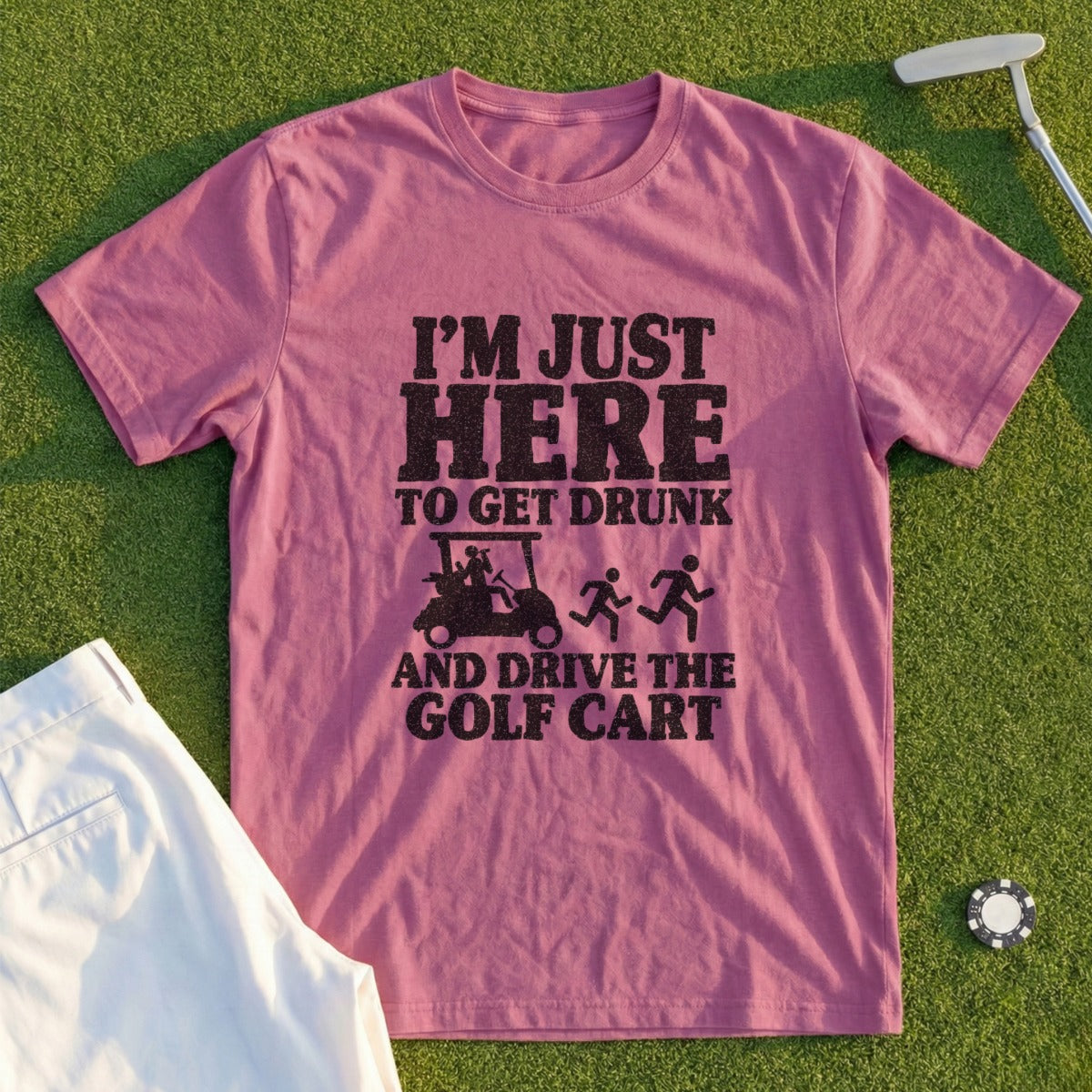 Pink t-shirt with text "I'M JUST HERE TO GET DRUNK AND DRIVE THE GOLF CART".
