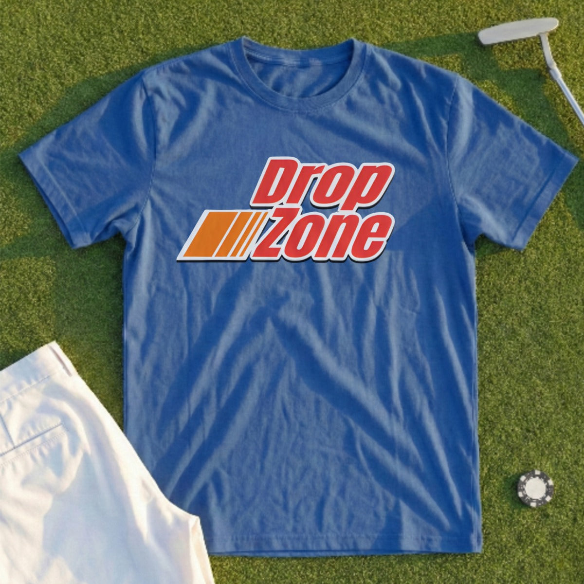 Blue t-shirt with red and orange "DropZone" logo, displayed on grass.