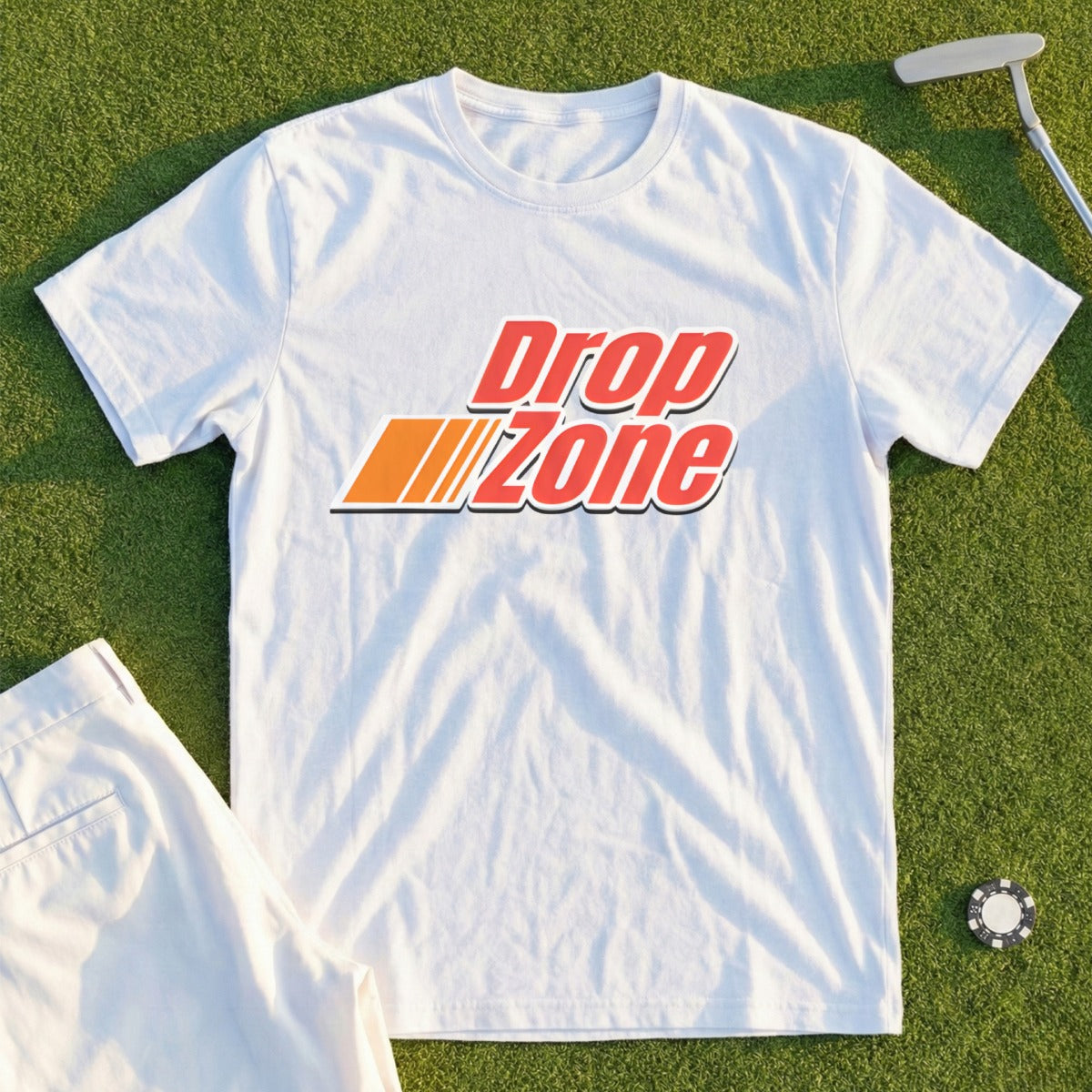 White t-shirt with red and orange "Drop Zone" logo and golf accessories.