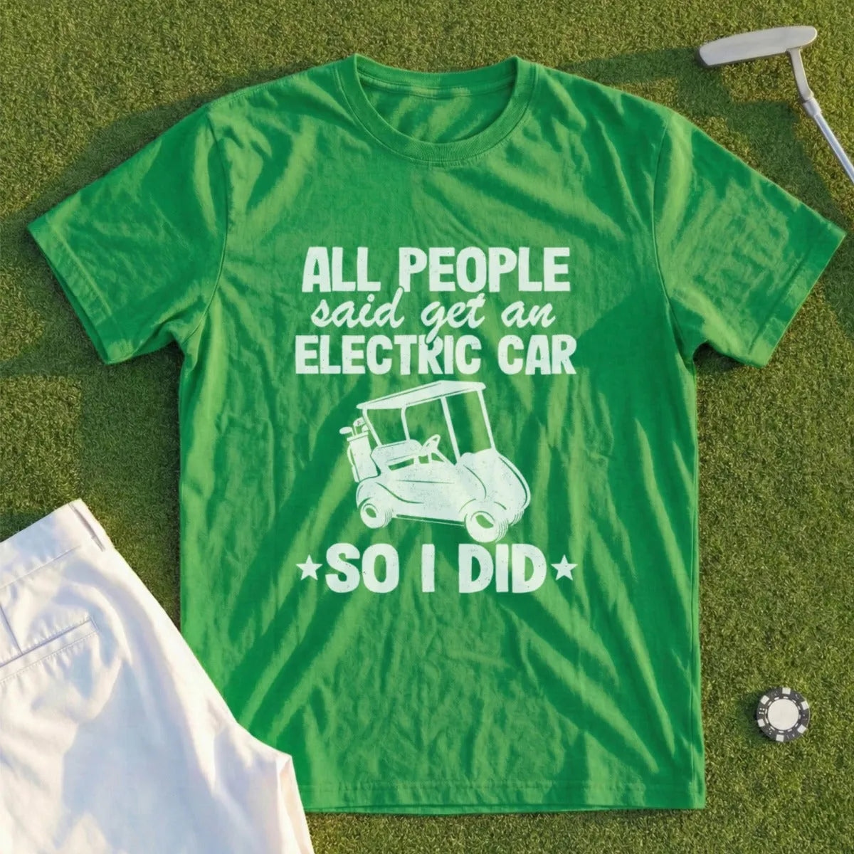 Green t-shirt with "All people said get an electric car, so I did" and golf cart graphic.