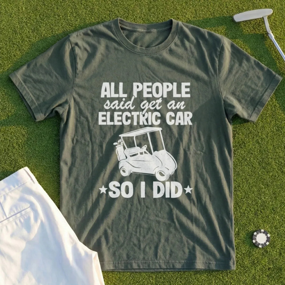 Green t-shirt with white text and graphics, saying "All people said get an electric car so I did".