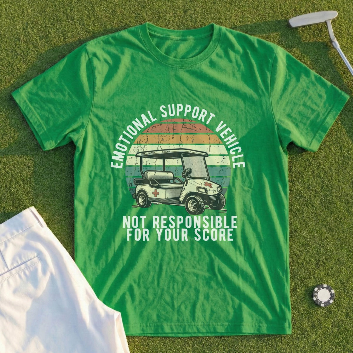 Green t-shirt with "Emotional Support Vehicle" and golf cart graphic.