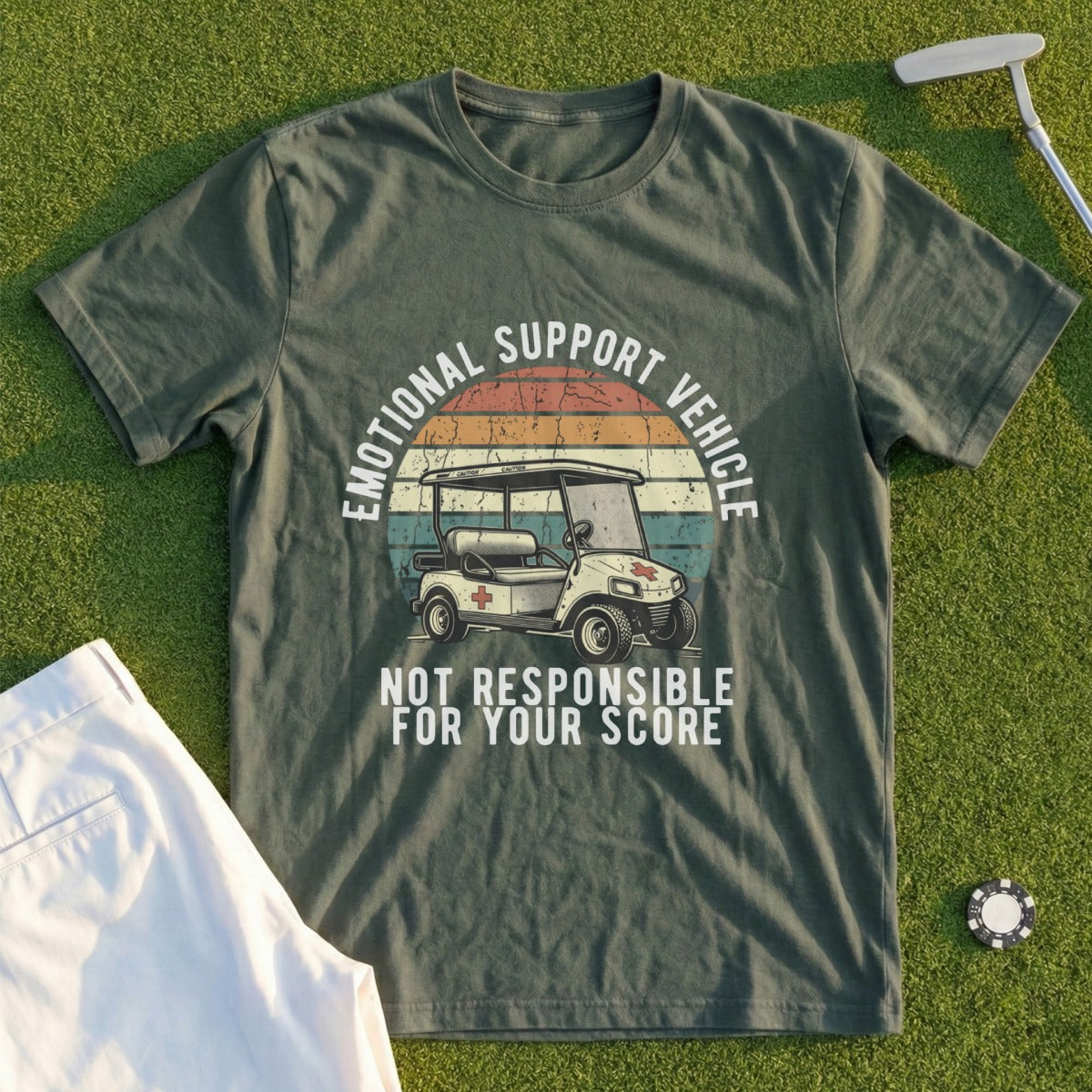 Green t-shirt with golf cart graphic and text "EMOTIONAL SUPPORT VEHICLE NOT RESPONSIBLE FOR YOUR SCORE".