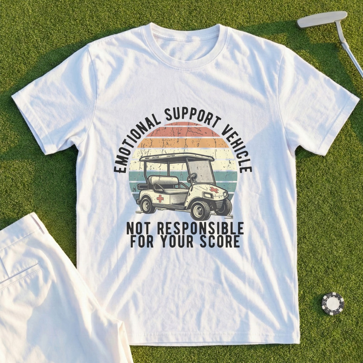 White t-shirt with "Emotional Support Vehicle" text and golf cart graphic.