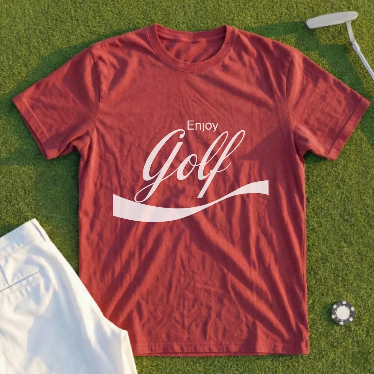 Red t-shirt with "Enjoy Golf" text, white shorts, golf tee, and club.