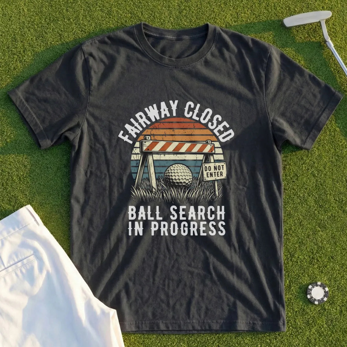 Dark t-shirt with "Fairway Closed Ball Search In Progress" graphic.