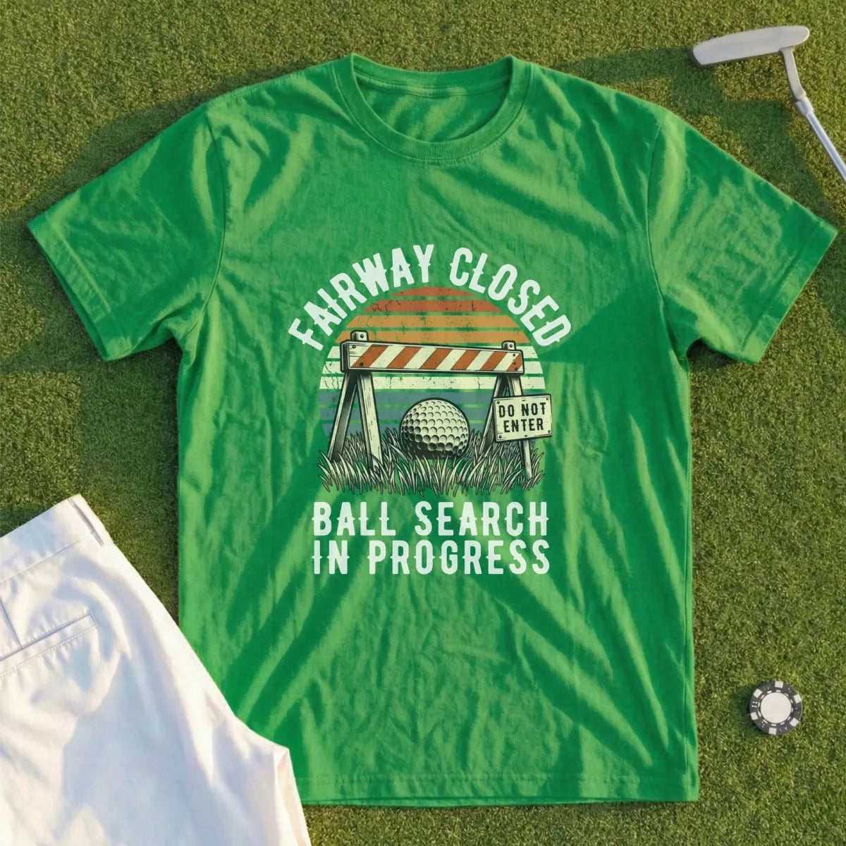Green t-shirt with "Fairway Closed Ball Search in Progress" text and golf ball.