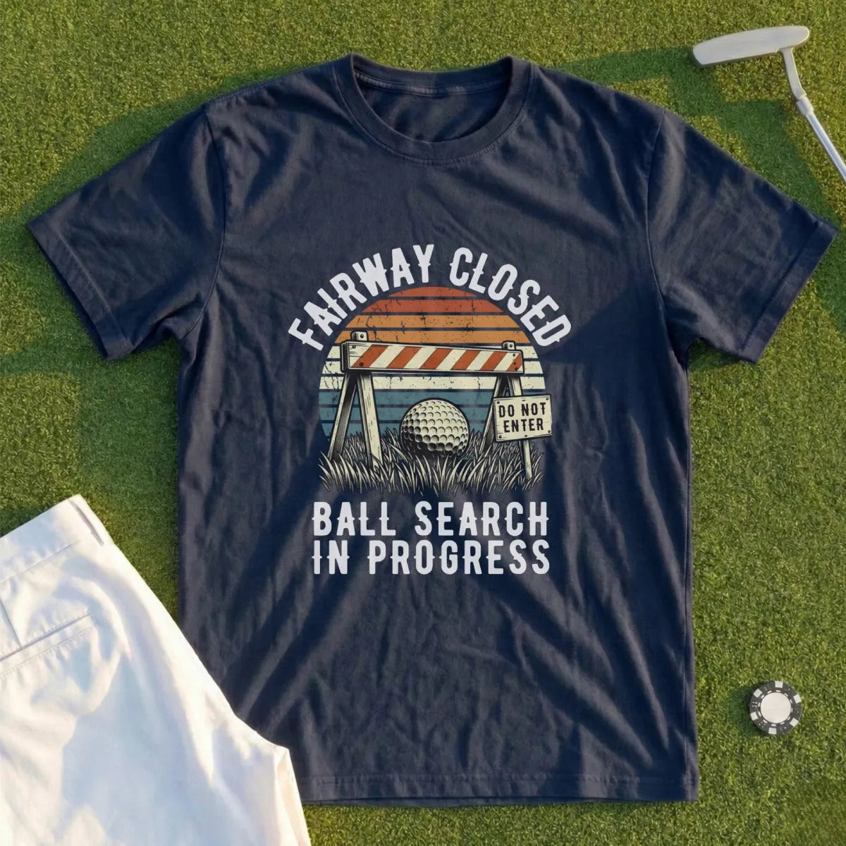 Navy t-shirt with "Fairway Closed Ball Search In Progress" graphic.