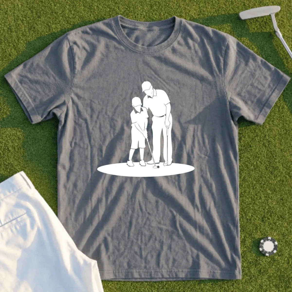 Graphic tee with silhouette of adult teaching child to golf.
