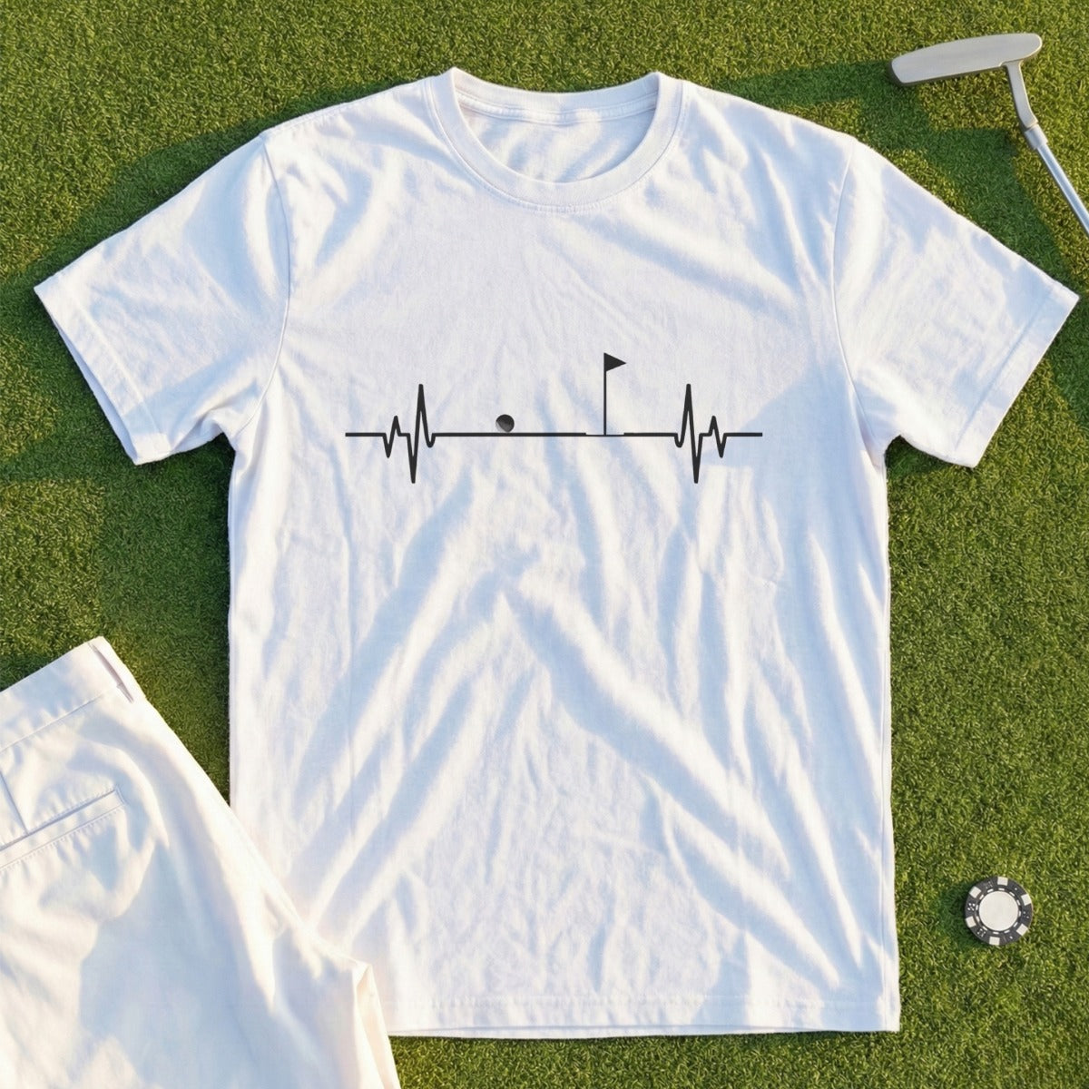 White t-shirt with a golf-themed heartbeat graphic and pocket.