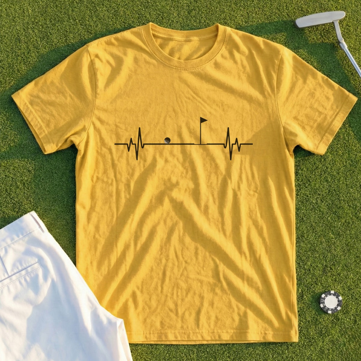 Yellow t-shirt with golf heartbeat graphic, flag, ball, and putting green.