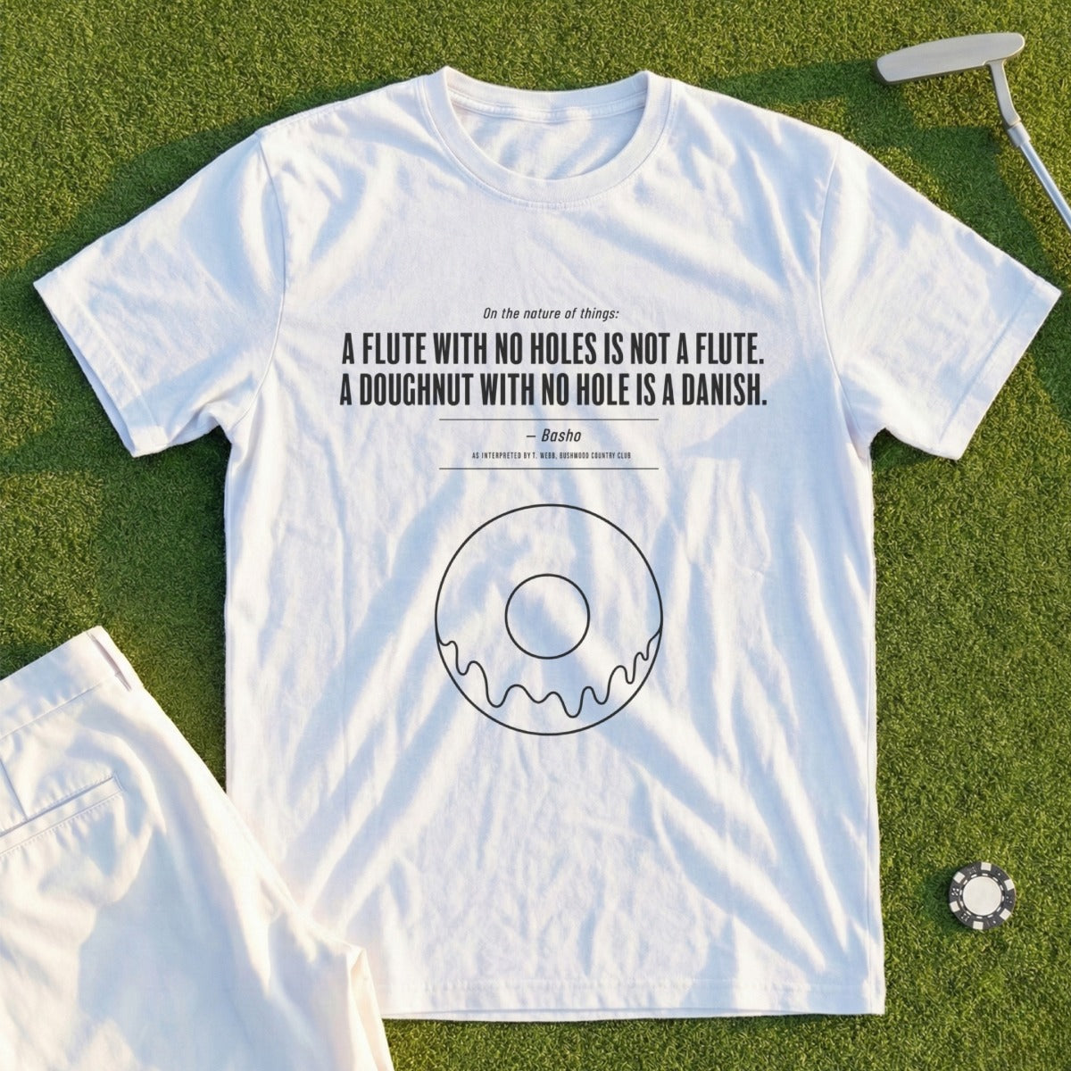 White t-shirt with quote about flutes and Danish doughnuts.