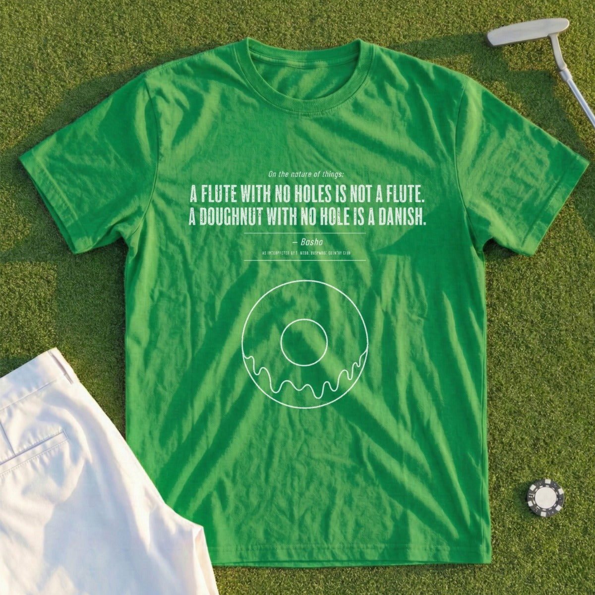 Green t-shirt with a quote about flutes and doughnuts, and a donut graphic.