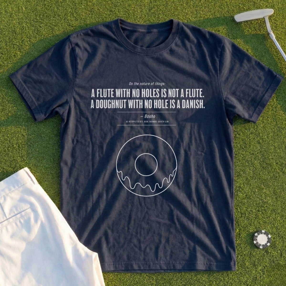 Navy t-shirt with quote about flutes and doughnuts, and a doughnut graphic.