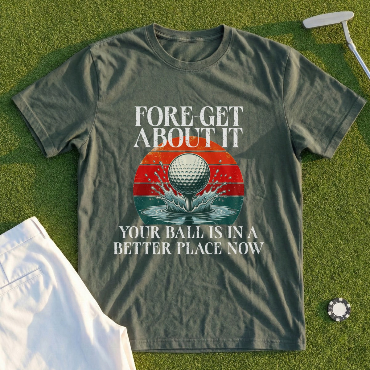 Green t-shirt with "Fore-get about it, your ball is in a better place now" and golf ball graphic.
