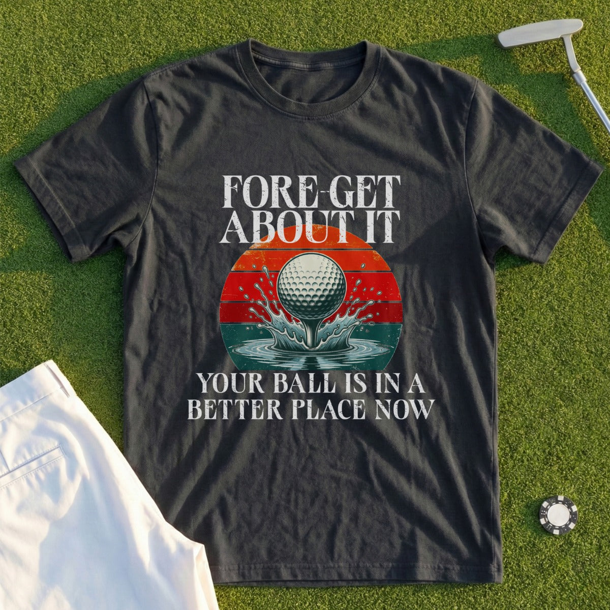 Dark t-shirt with "FORE-GET ABOUT IT" and golf ball on tee text.
