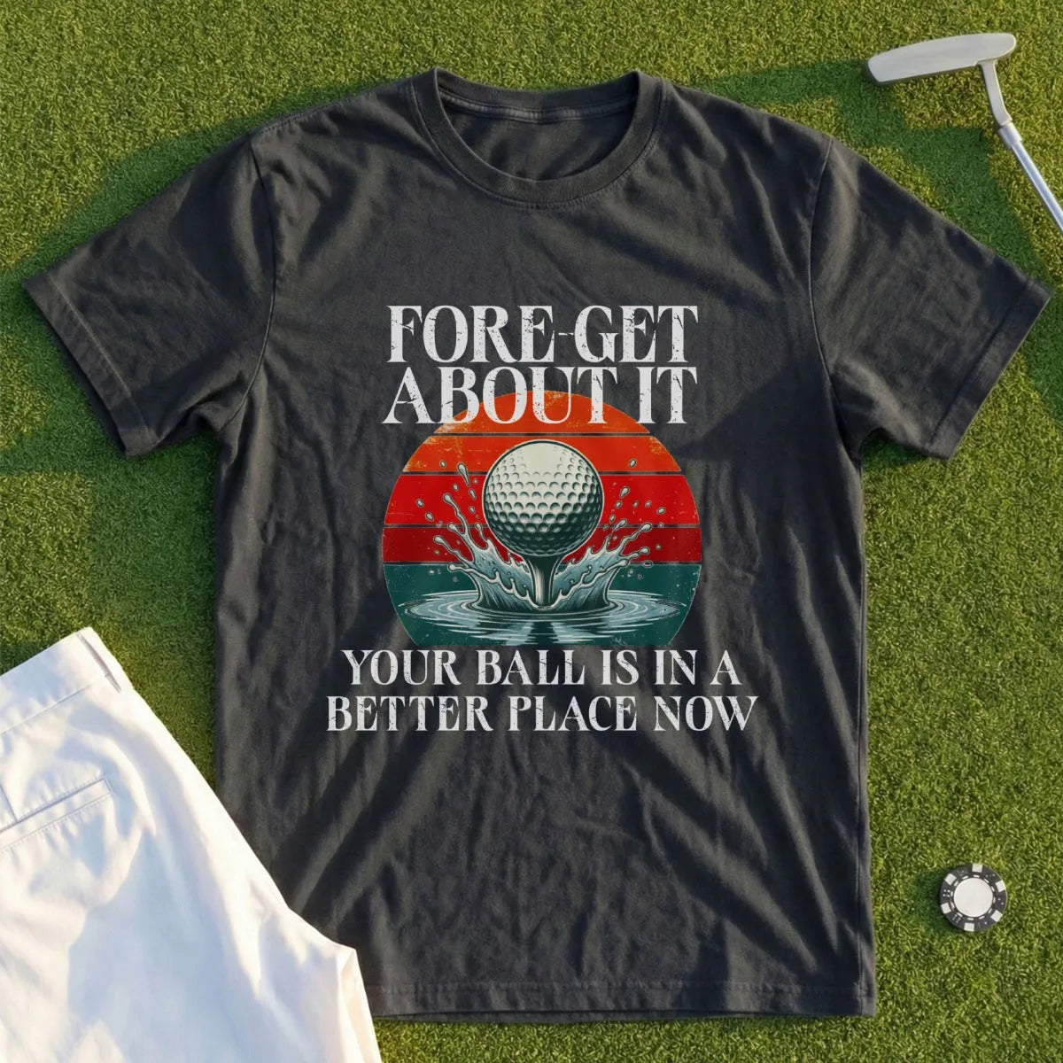 Dark t-shirt with "FORE-GET ABOUT IT" and golf ball on tee text.