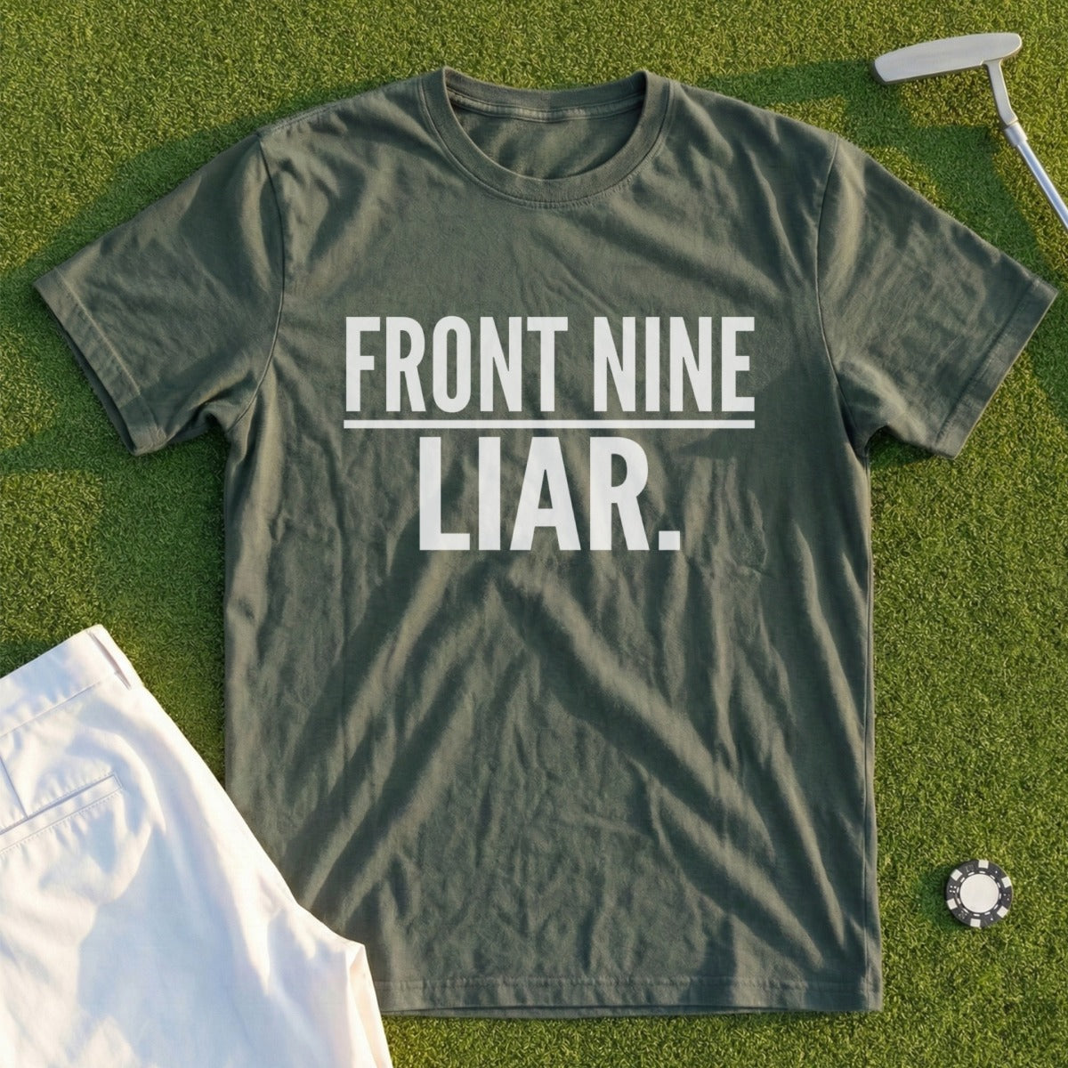 Green t-shirt with "FRONT NINE LIAR." text, on a golf course.