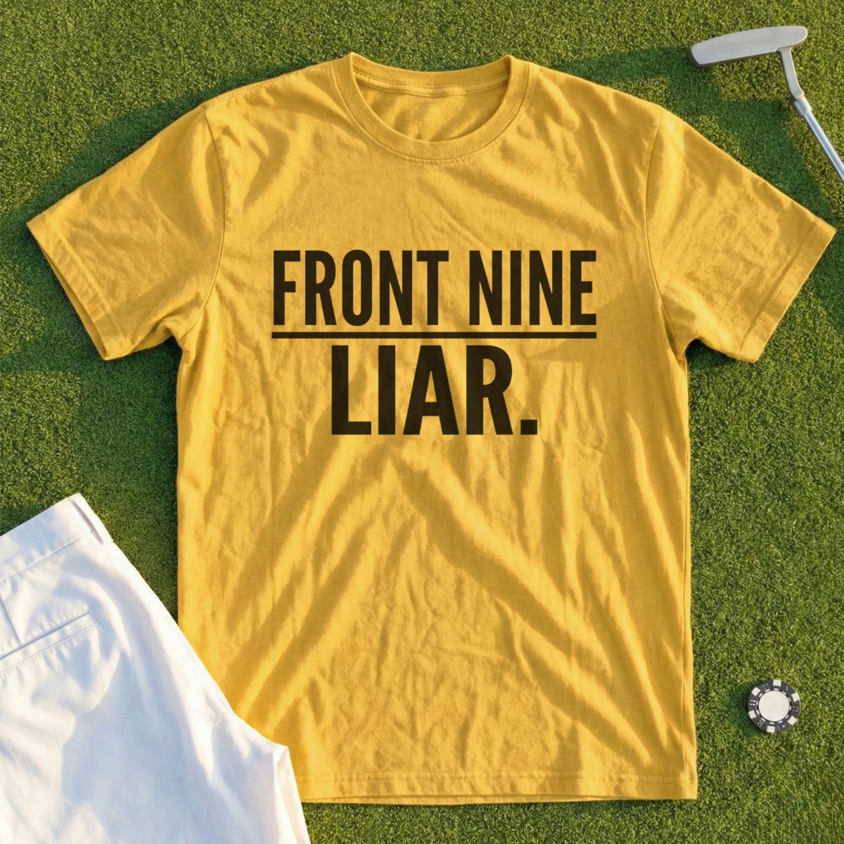 Yellow t-shirt with "FRONT NINE LIAR." text, golf accessories.