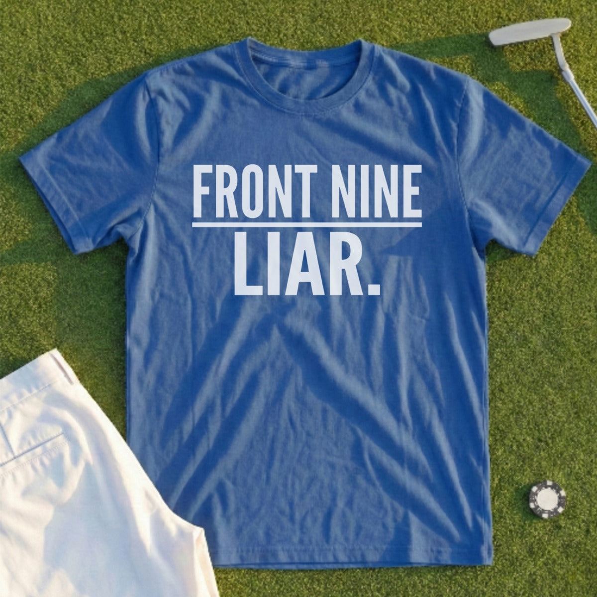 Blue t-shirt with "FRONT NINE LIAR." text, on grass with golf attire.