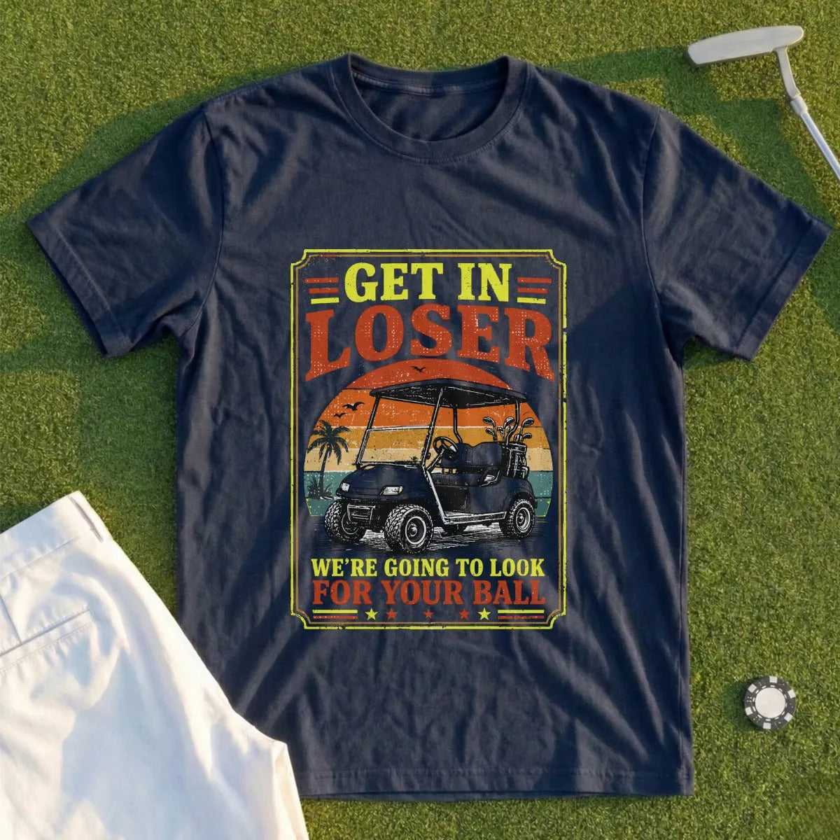 Navy t-shirt with "Get In Loser, We're Going to Look For Your Ball" text and golf cart graphic.