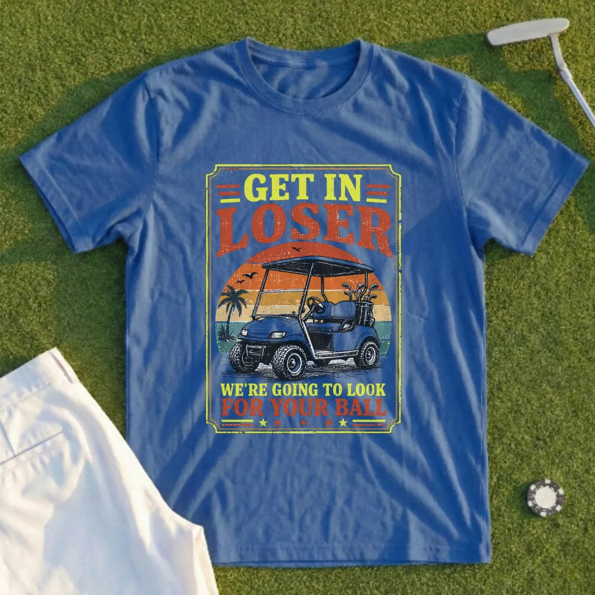 Blue t-shirt with "Get in Loser, We're Going to Look for Your Ball" and a golf cart.