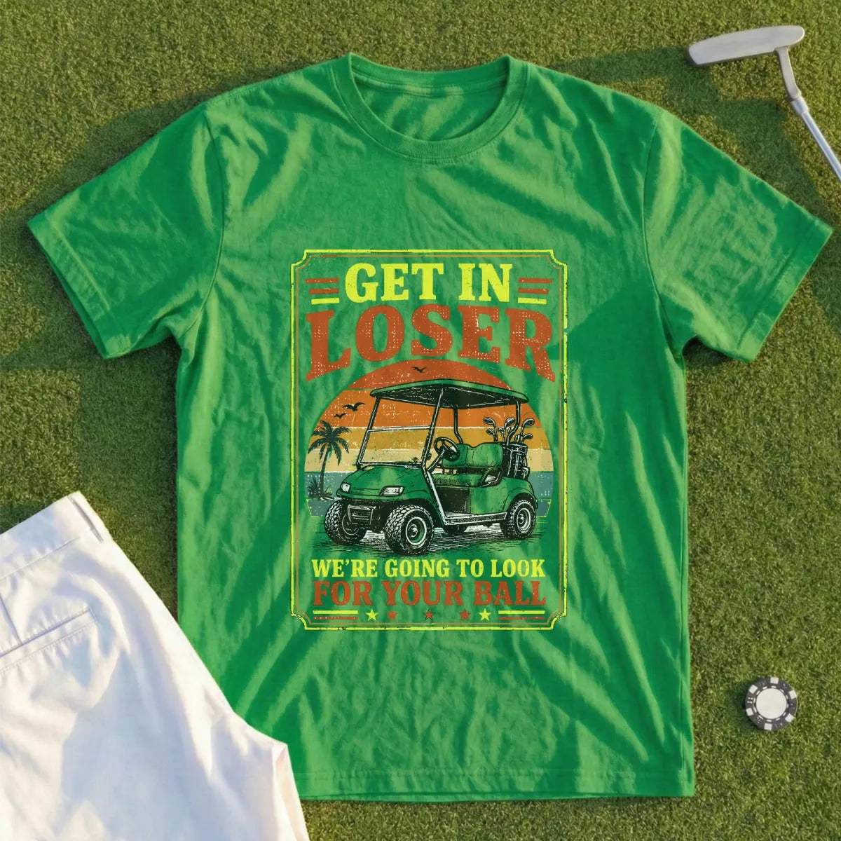 Green t-shirt with "Get in Loser We're Going to Look for Your Ball" text and golf cart.