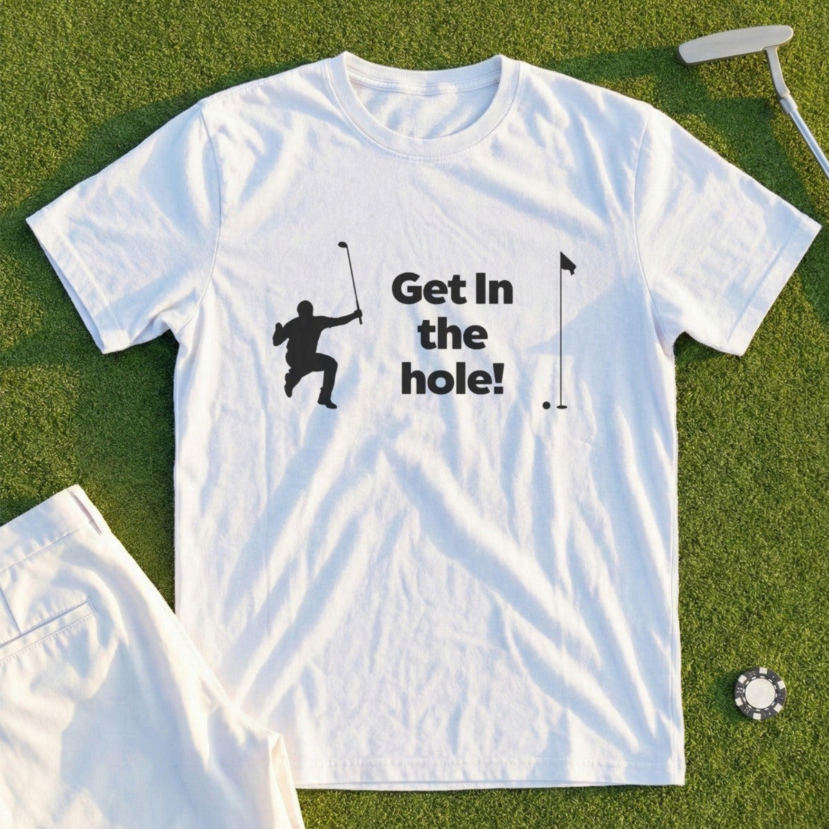 White t-shirt with "Get in the hole!" text and golf graphic.