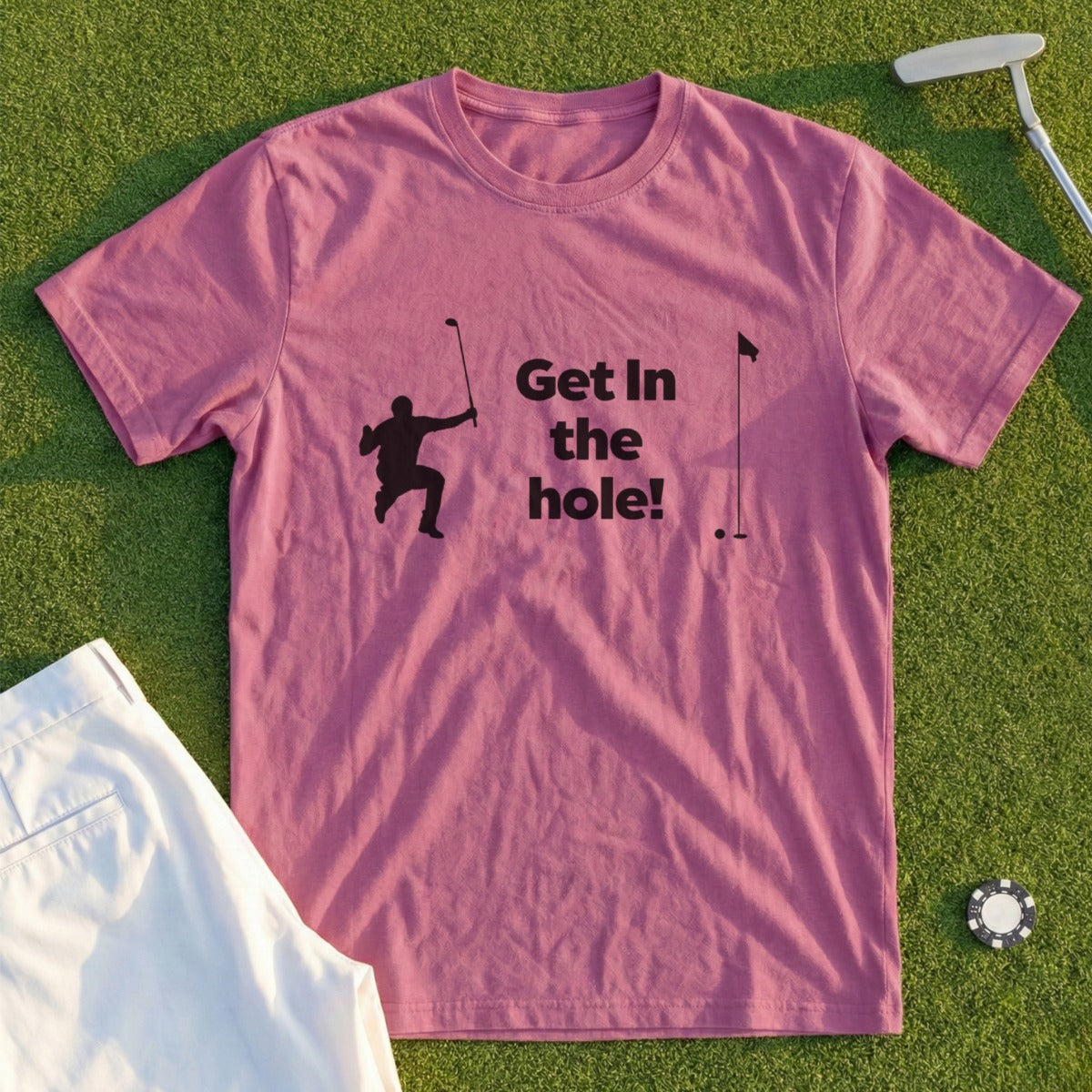 Pink t-shirt with "Get in the hole!" text and golfer graphic.