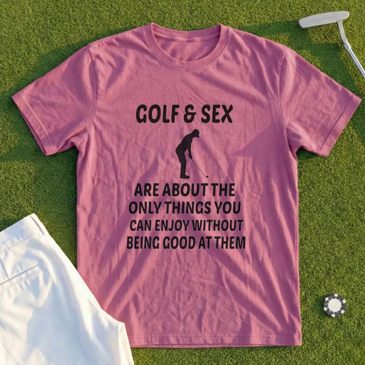 Pink t-shirt with black text: "GOLF & SEX ARE ABOUT THE ONLY THINGS YOU CAN ENJOY WITHOUT BEING GOOD AT THEM".