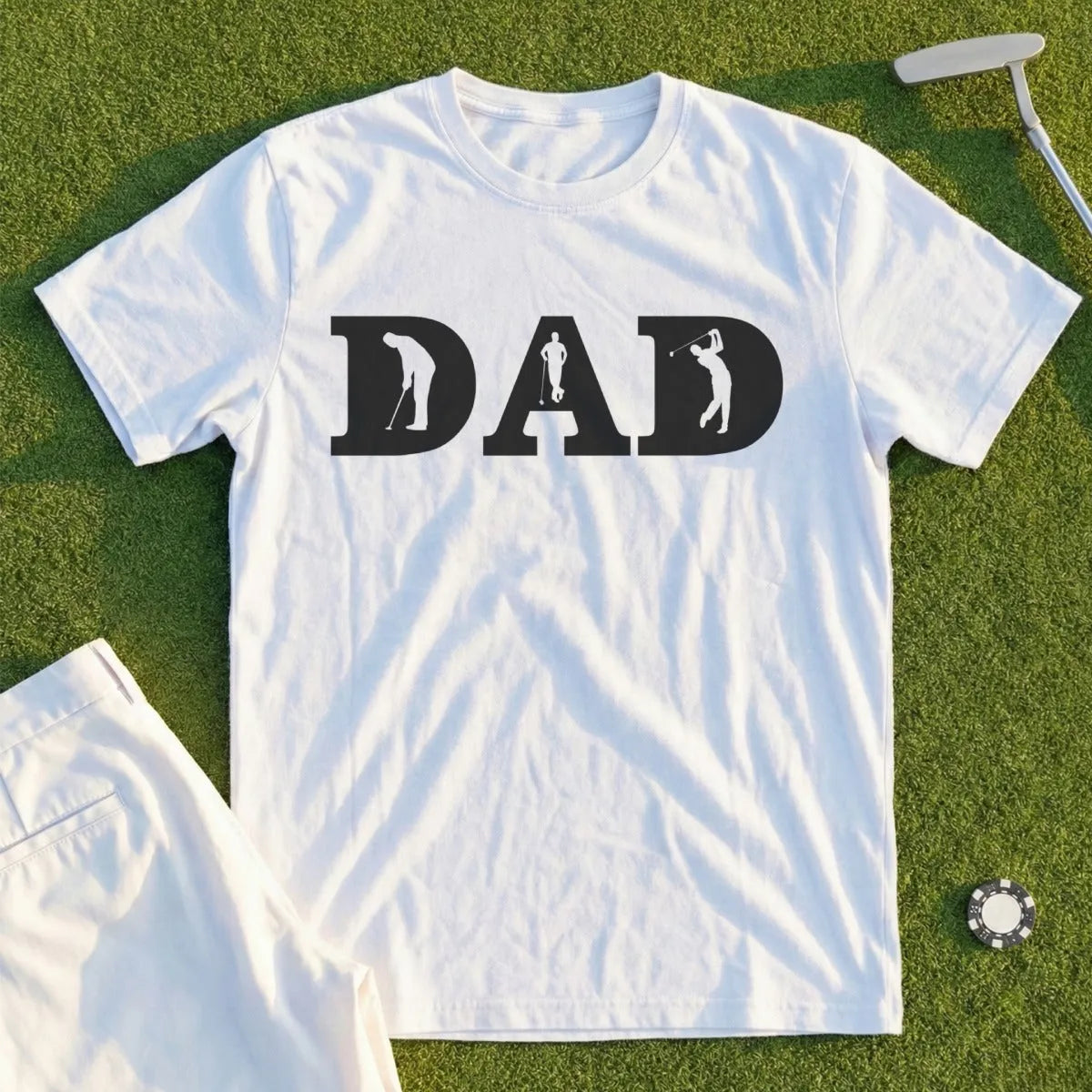 White t-shirt with "DAD" in large letters, each letter replaced by a golfer silhouette.