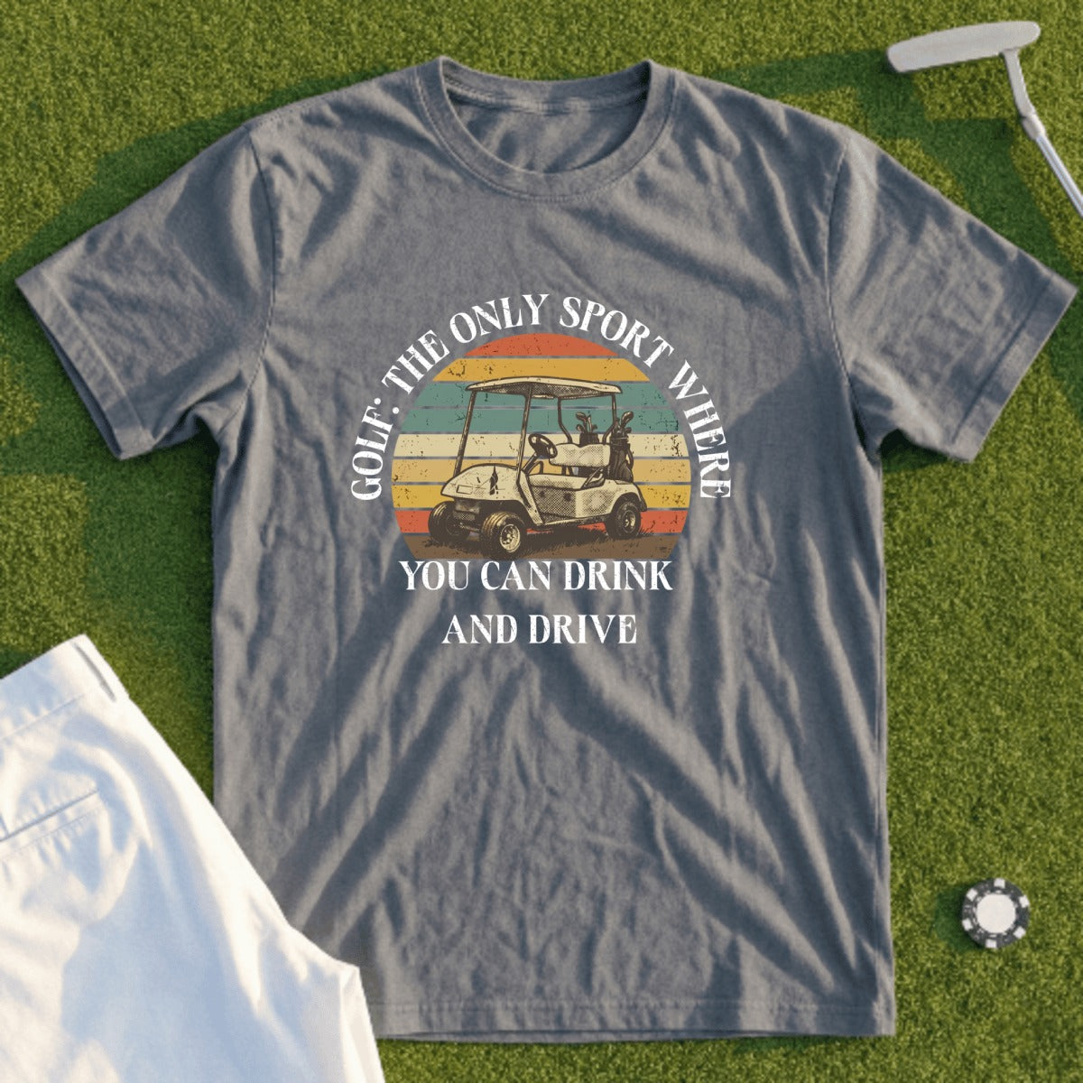 Grey t-shirt with "Golf: The Only Sport Where You Can Drink and Drive" text and golf cart graphic.