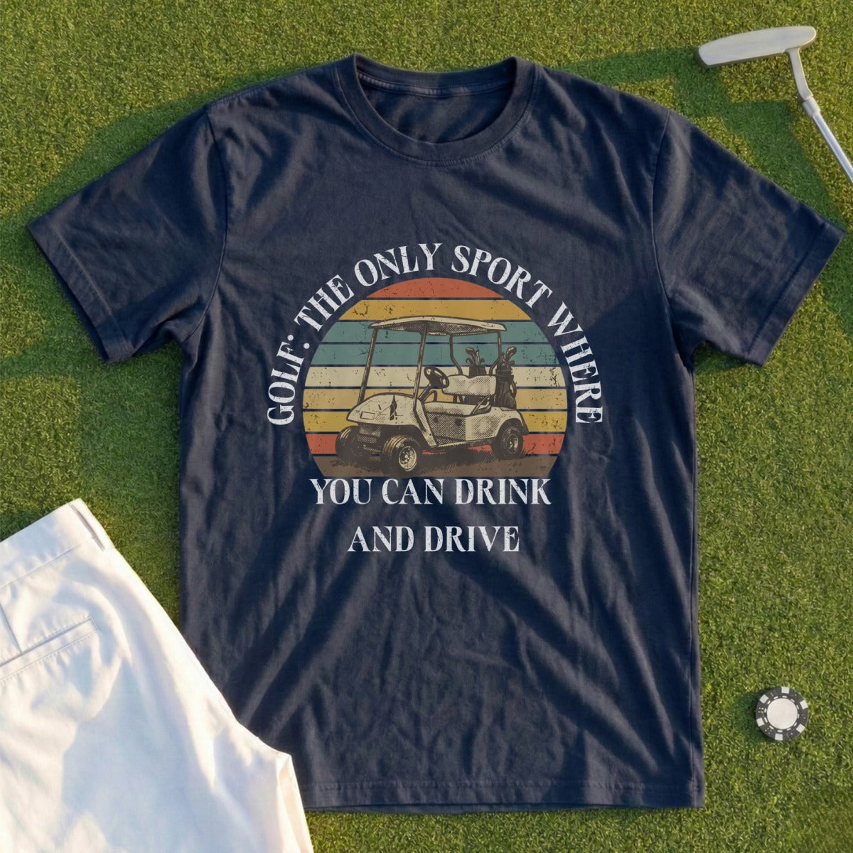 Navy t-shirt with "Golf: The Only Sport Where You Can Drink and Drive" text and golf cart graphic.
