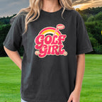 Golf Girl, Groovy Script Sunset Tee worn on the golf course, Black