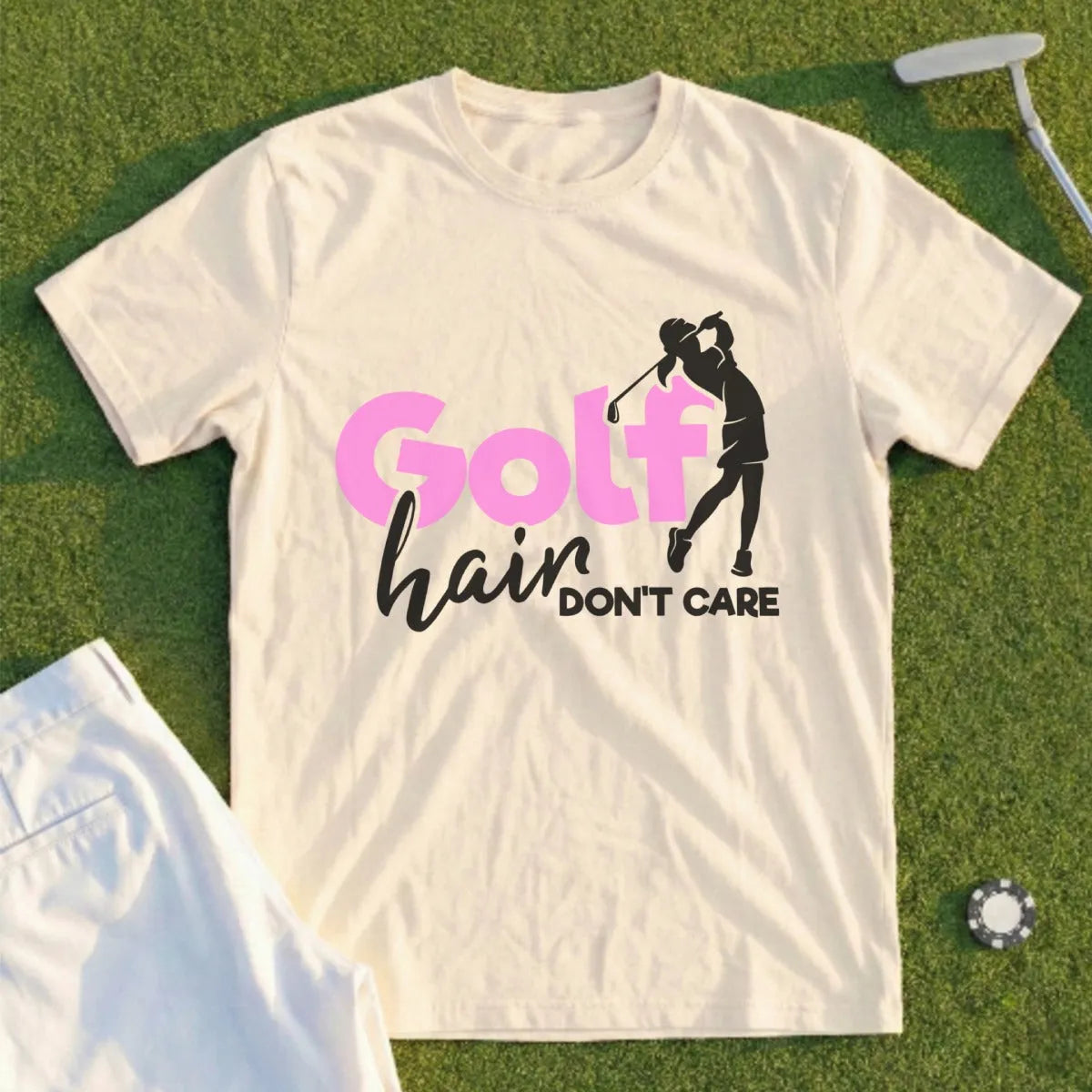 Cream t-shirt with "Golf hair don't care" graphic and golfer silhouette.