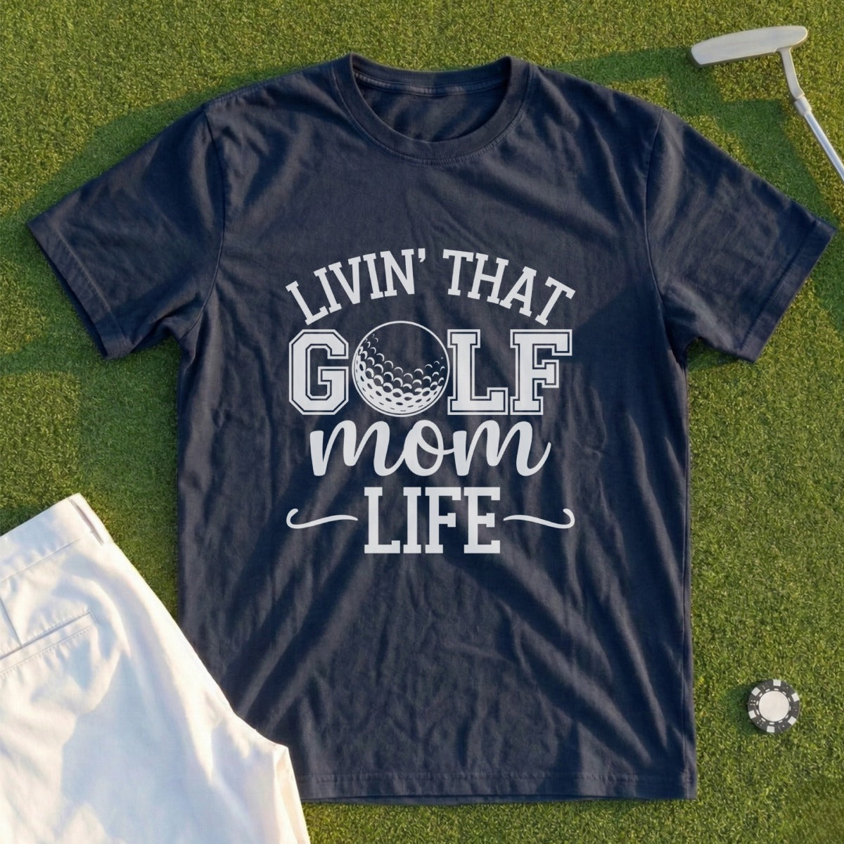 Dark blue t-shirt with "Livin' that Golf Mom Life" text and golf ball graphic.