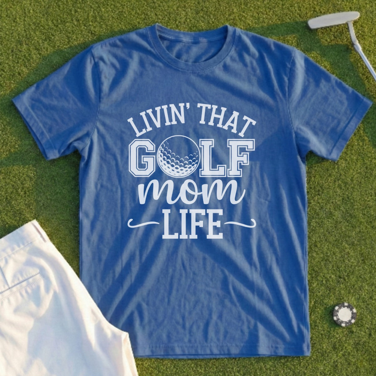 Blue t-shirt with "Livin' That Golf Mom Life" text and golf ball graphic.