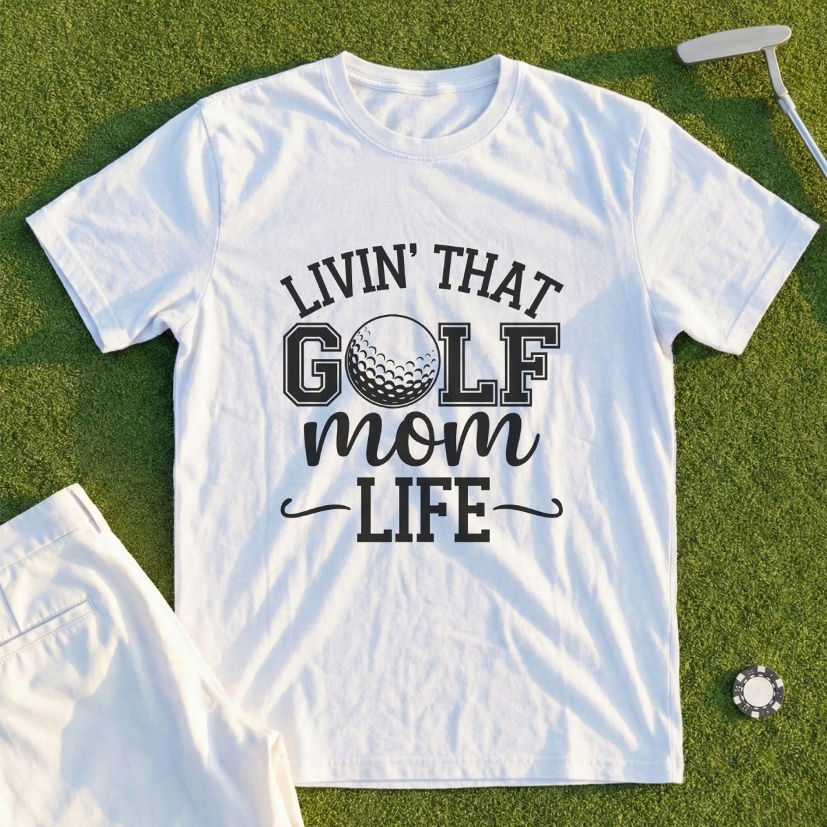 White t-shirt with "Livin' That Golf Mom Life" text and a golf ball graphic.