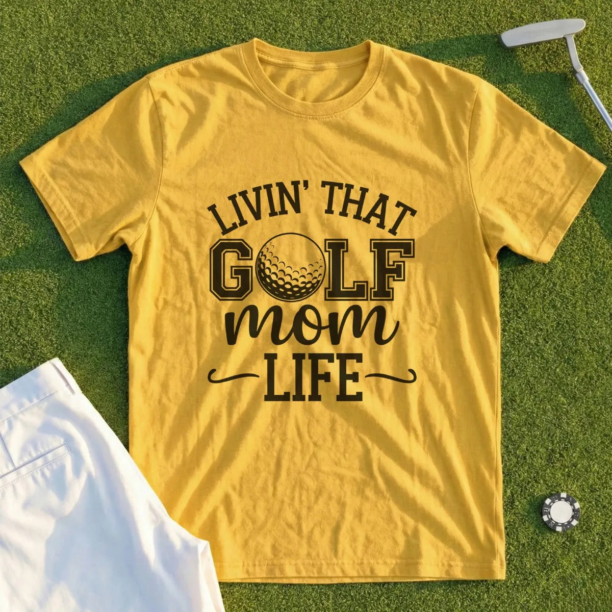 Yellow t-shirt with "Livin' That Golf Mom Life" text and a golf ball.