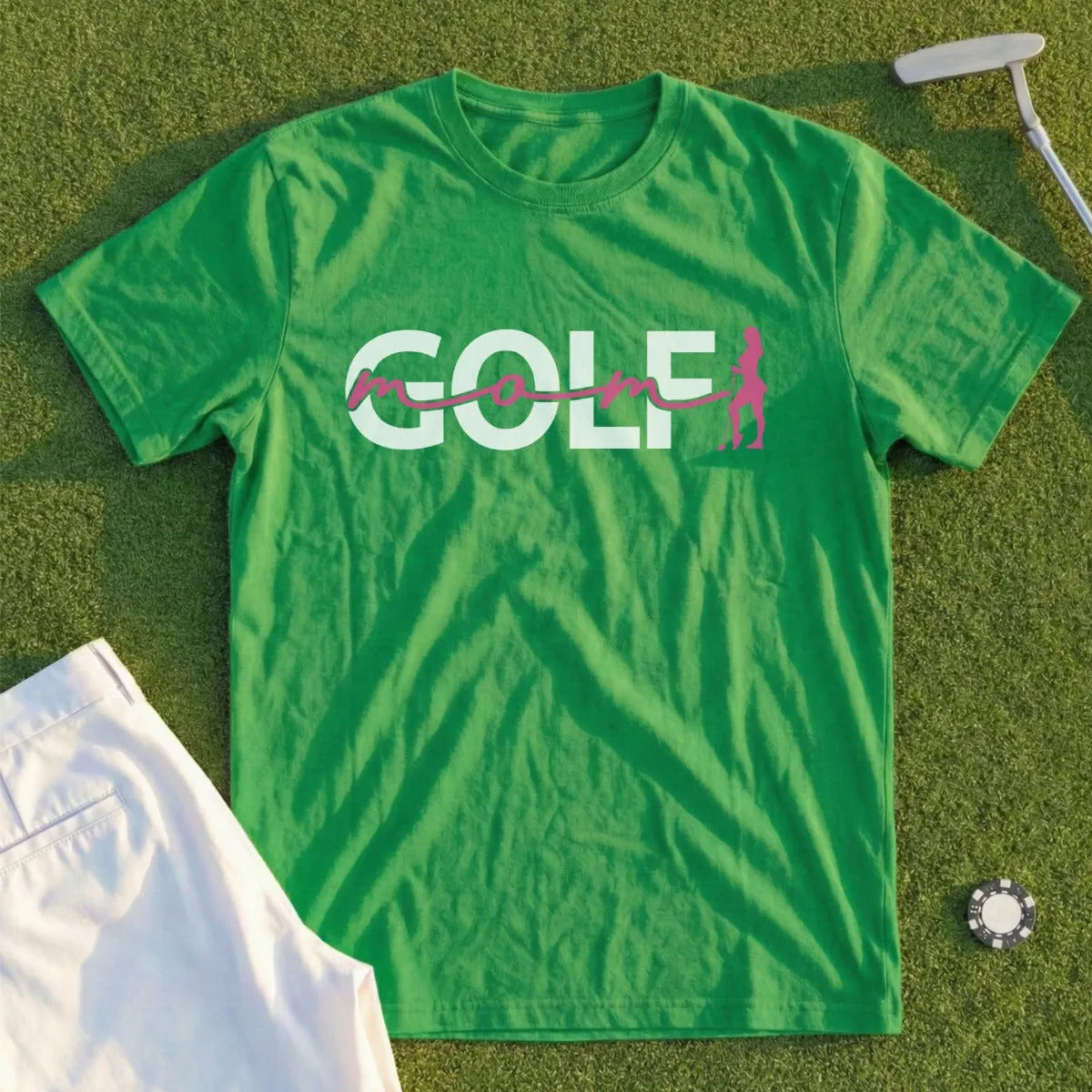 Green t-shirt with "golf" text and a pink golf player silhouette.