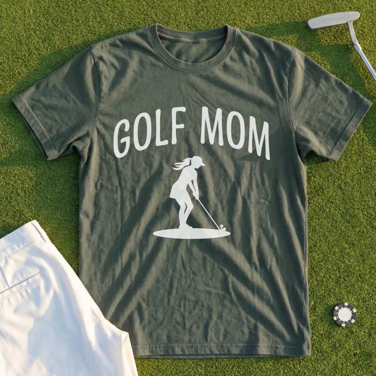 Dark green t-shirt with "GOLF MOM" text and silhouette of a woman golfing.