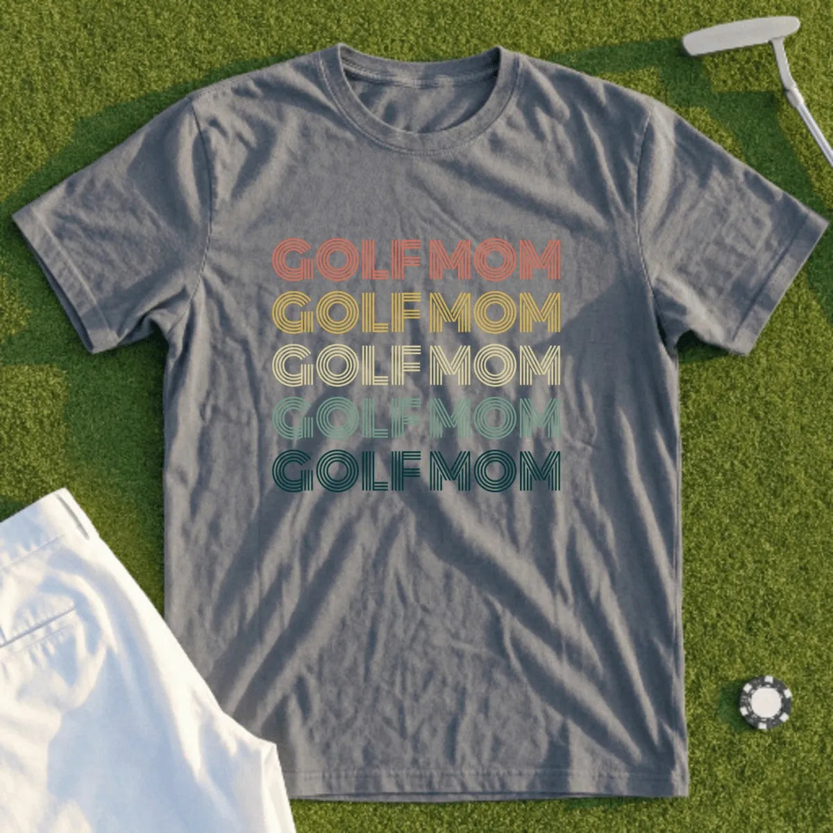Gray t-shirt with "GOLFMOM" repeated in retro colors.