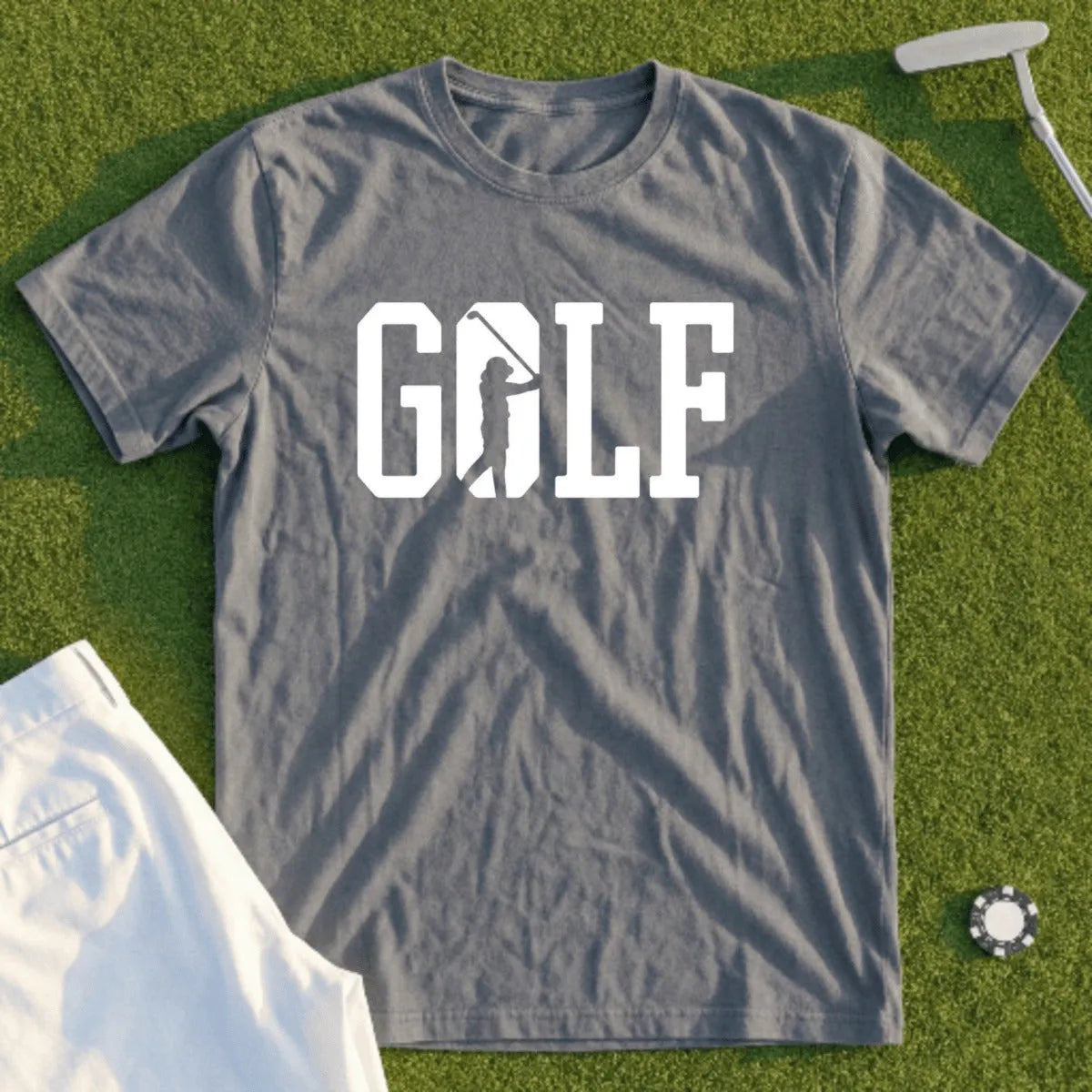 Gray t-shirt with white "GOLF" text and golfer silhouette on green grass.